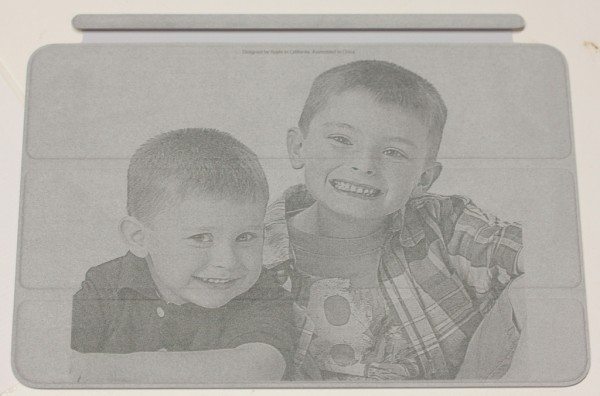 Photo engraved on inside of light gray smart cover